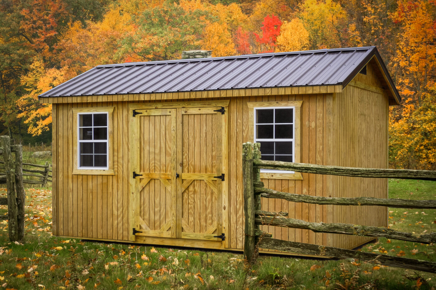 A wooden shed standing by a wooden fence in Louisville KY