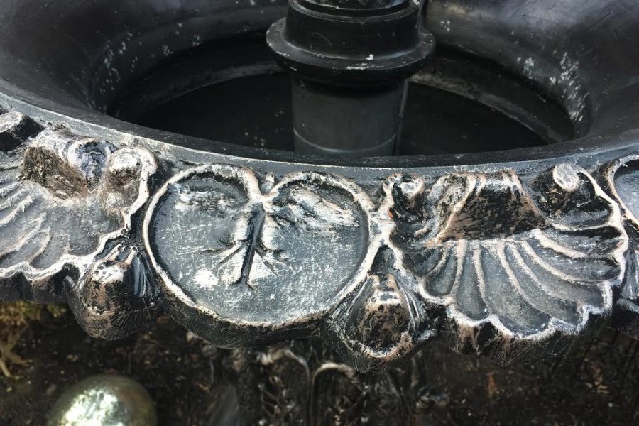 close up of cast aluminum fountain with leaf imprints