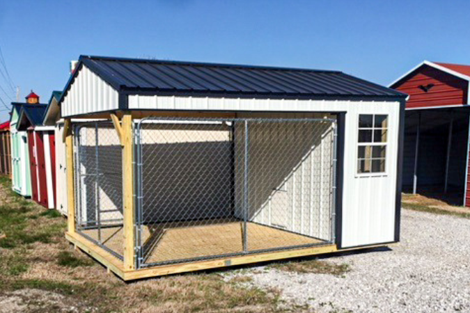 white and black trimmed dog kennel size 10x16 with black metal roof and attached run